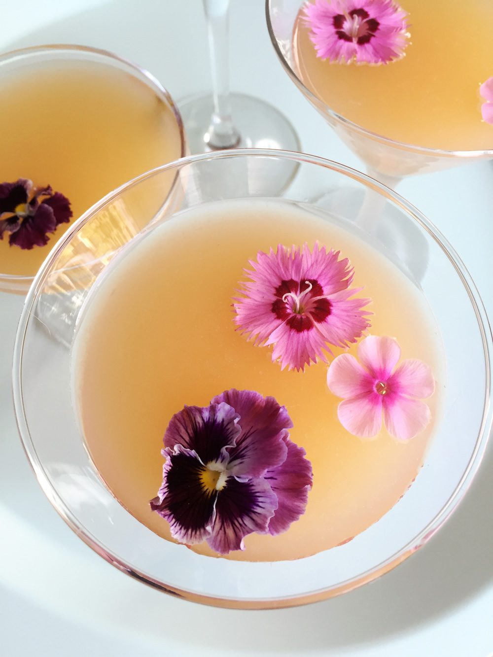 Edible flowers floating in a drink