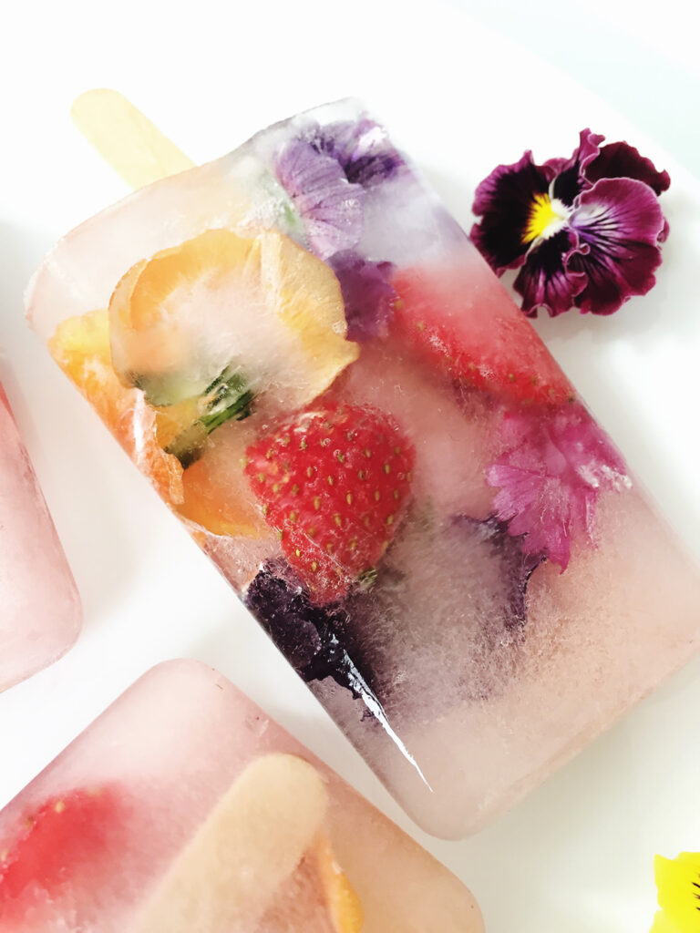 Edible flower and fruit ice lolly