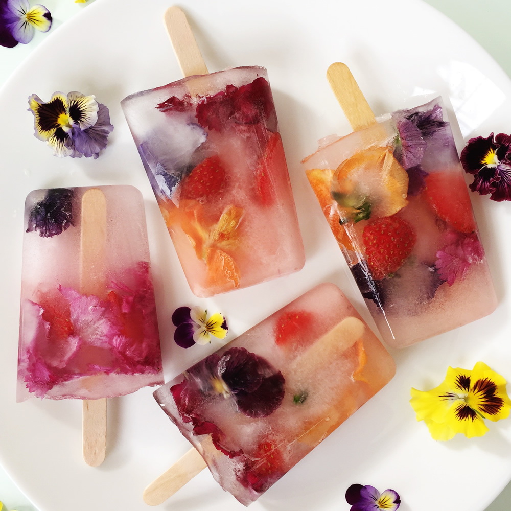 Edible flowers and fruit ice lollies