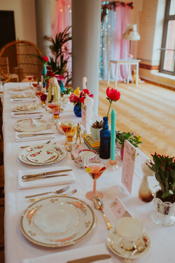 Wedding table with edible flowers in cocktails